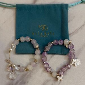 Purple and White Beaded Bracelets with Charms